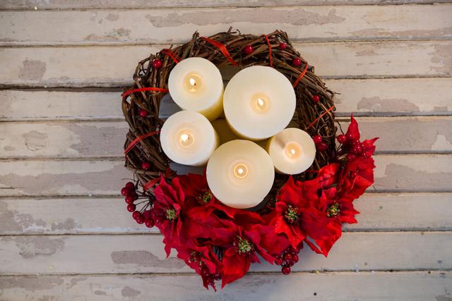 Candles decorated with flowers nest basket on wooden plank - Download Free Stock Photos Pikwizard.com