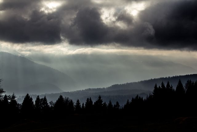 a mountain range with dark clouds - Download Free Stock Photos Pikwizard.com