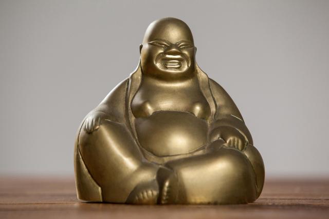 Gold painted laughing buddha figurine - Download Free Stock Photos Pikwizard.com