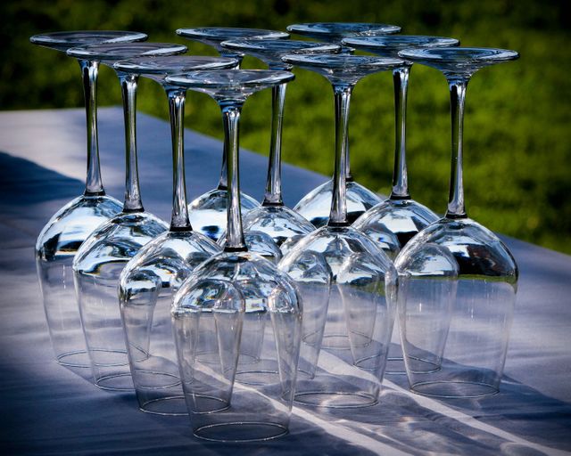 a table with a bunch of empty wine glasses - Download Free Stock Photos Pikwizard.com