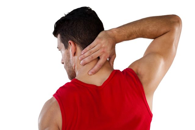 Rear view of American football player suffering from neck pain - Download Free Stock Photos Pikwizard.com