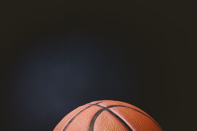 Close up of basketball on black background
