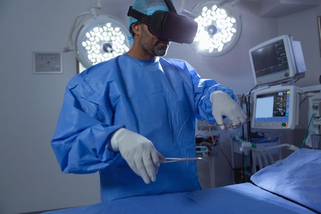 Male surgeon using virtual reality headset while practicing surgery in operation room at hospital - Download Free Stock Photos Pikwizard.com