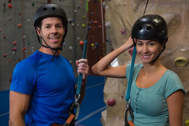 Portrait of athletes in sports helmet standing by climbing wall - Download Free Stock Photos Pikwizard.com