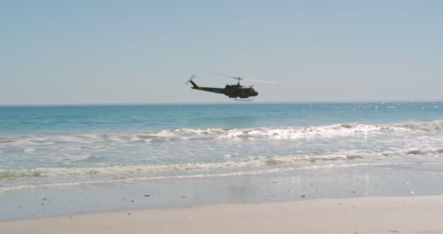 Sunny beach with blue clear sea and waves with helicopter under water flying over blue sky - Download Free Stock Photos Pikwizard.com