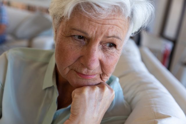 Close up of senior caucasian woman sitting on the couch at home - Download Free Stock Photos Pikwizard.com