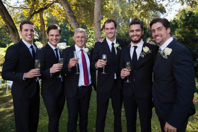 Portrait of groom and groomsmen having champagne - Download Free Stock Photos Pikwizard.com