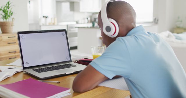Image of focused african american boy with laptop with copy space having online lessons at home - Download Free Stock Photos Pikwizard.com