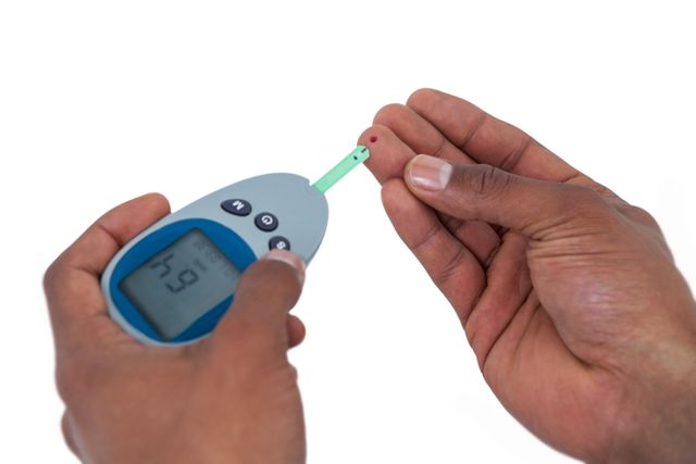 Close-up of man hands testing blood sugar with glucometer- Download Free Stock Photos Pikwizard.com