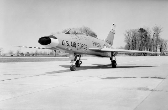  North American F-100 C airplane used in sonic boom investigation at Wallops, October 7, 1958.  Photograph published in: A New Dimension  Wallops Island Flight Test Range: The First Fifteen Years by Joseph Shortal. A NASA publication. Page 672. -- Aircraft number: NACA 42024. Side view, 3/4 view from front, 3/4 view from rear, rear view, and two front views.