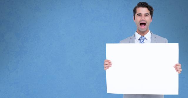 Businessman screaming while holding bill board - Download Free Stock Photos Pikwizard.com