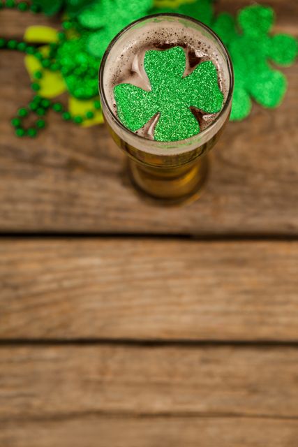 Glass of beer and shamrock for St Patricks Day - Download Free Stock Photos Pikwizard.com