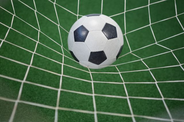 Football in goalpost against artificial grass - Download Free Stock Photos Pikwizard.com