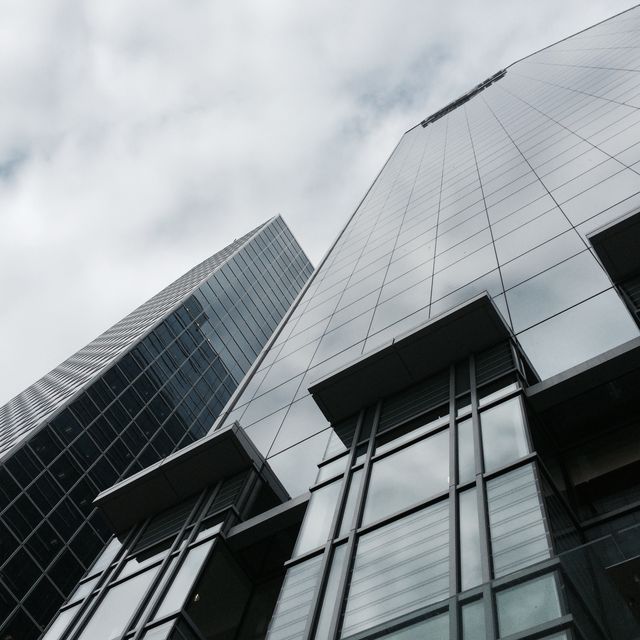 Low angle view of tall buildings against the sky. Office architecture and business concept
