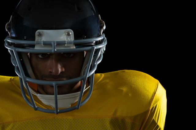 American football player with a head gear- Download Free Stock Photos Pikwizard.com