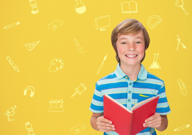 Boy holding a book against school background - Download Free Stock Photos Pikwizard.com