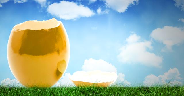 Digital composite of Cracked Easter egg in front of blue sky
