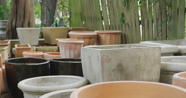 Close up of multiple empty flowerpots in garden - Download Free Stock Photos Pikwizard.com