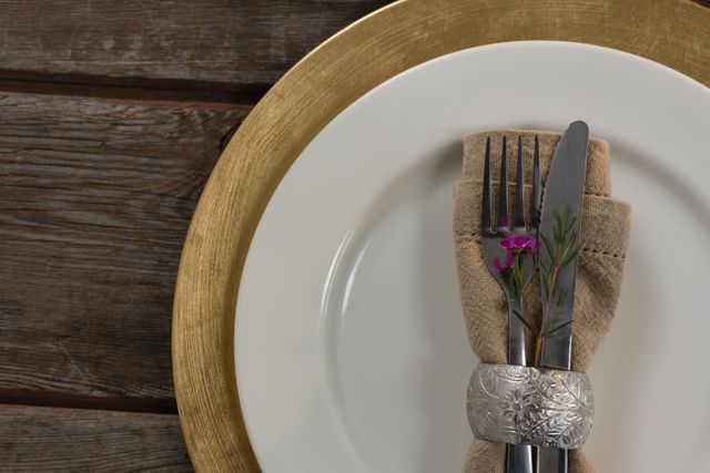 Close-up of elegance table setting on wooden plank