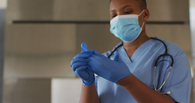 African american female doctor wearing face mask and gloves - Download Free Stock Photos Pikwizard.com