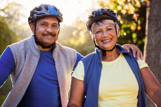 Portrait of mature couple holding cycling helmet  - Download Free Stock Photos Pikwizard.com