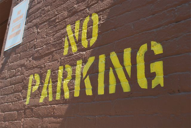 No parking sign bricks- Download Free Stock Photos Pikwizard.com