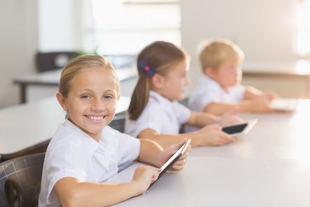 Schoolgirl using digital tablet in classroom - Download Free Stock Photos Pikwizard.com