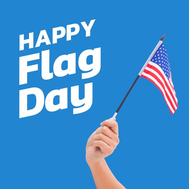 National flag day text by caucasian hand holding america flag against blue background. digital composite, symbolism, patriotism and identity concept.
