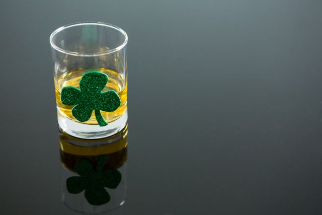 St Patricks Day glass of whisky with shamrock - Download Free Stock Photos Pikwizard.com