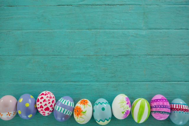 Painted Easter eggs on wooden surface - Download Free Stock Photos Pikwizard.com
