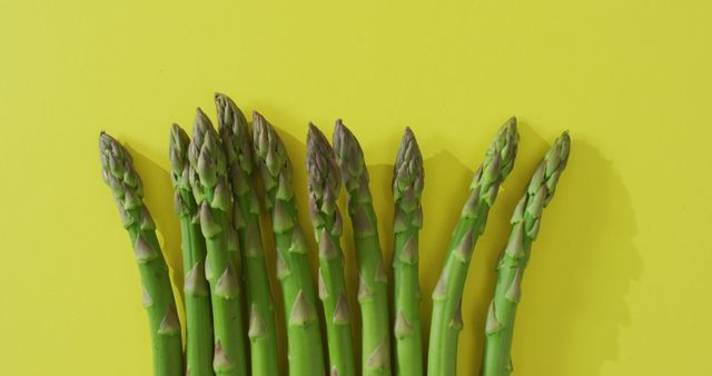 Image of fresh asparagus with copy space over green background - Download Free Stock Photos Pikwizard.com