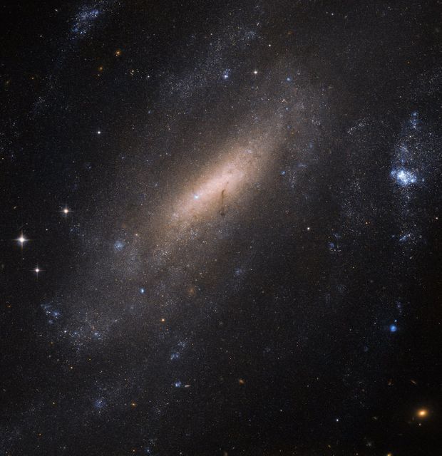 Hubble 'Crane-s' in for a Closer Look at a Galaxy - Download Free Stock Photos Pikwizard.com