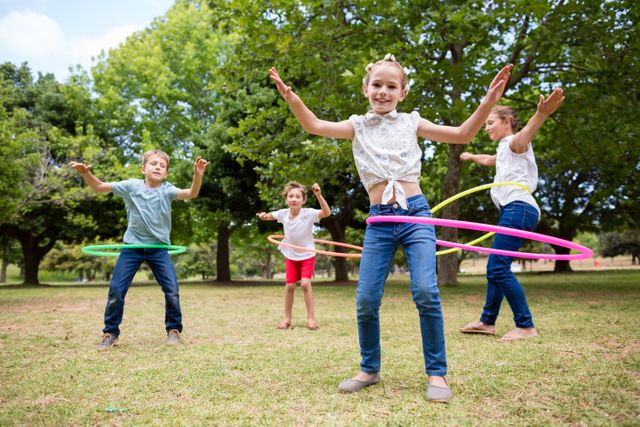 Kids playing with hula hoop - Download Free Stock Photos Pikwizard.com