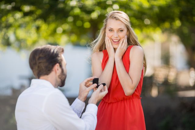 Man proposing a woman with a ring on his knee - Download Free Stock Photos Pikwizard.com