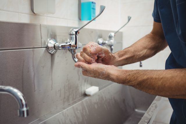 Male surgeon washing his hands - Download Free Stock Photos Pikwizard.com