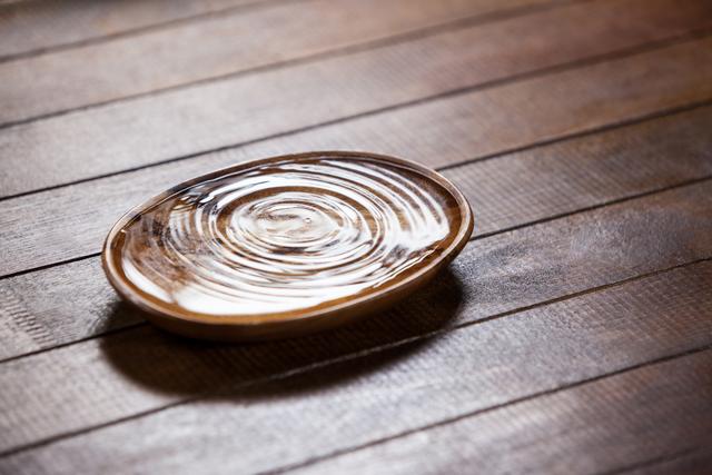 Water ripples in a wooden bowl - Download Free Stock Photos Pikwizard.com