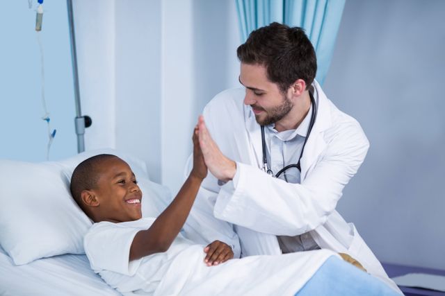 Doctor and patient giving high five - Download Free Stock Photos Pikwizard.com