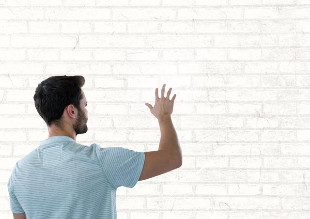 Man touching white wall - Download Free Stock Photos Pikwizard.com