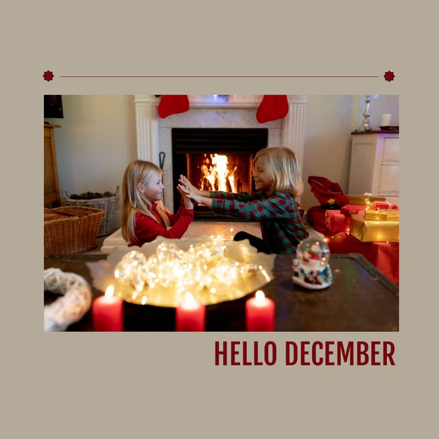 Composition of hello december text over caucasian siblings at christmas. Christmas, winter and celebration concept digitally generated image.