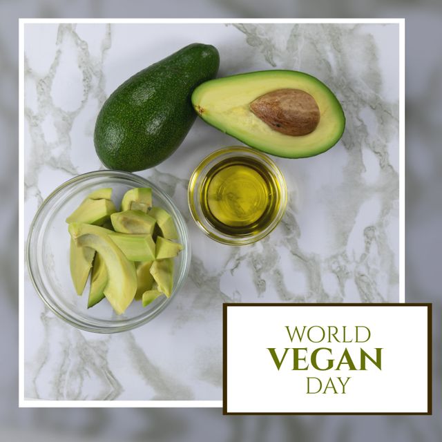 Digital composite of avocado slices and oil on marble table with world vegan day text - Download Free Stock Templates Pikwizard.com