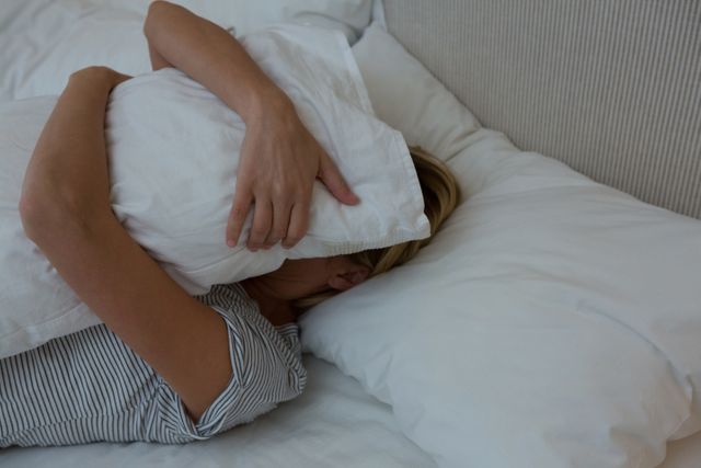 Woman sleeping peacefully on bed - Download Free Stock Photos Pikwizard.com