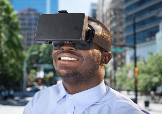 Man using virtual reality headset against city street in background - Download Free Stock Photos Pikwizard.com