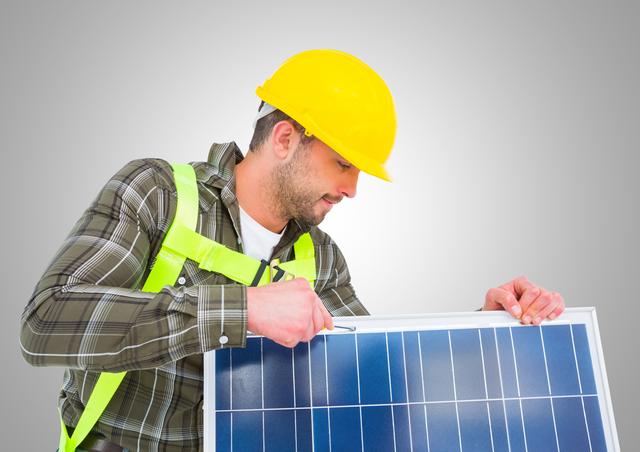 Worker fixing solar panel - Download Free Stock Photos Pikwizard.com