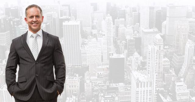 Smiling businessman standing with hands in pockets against city background - Download Free Stock Photos Pikwizard.com