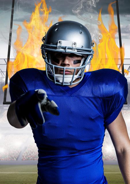 American foot ballplayer standing against flames and stadium - Download Free Stock Photos Pikwizard.com