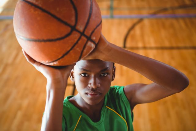 High angle view of teenage boy practicing basketball - Download Free Stock Photos Pikwizard.com