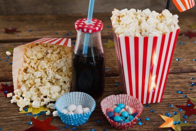 Popcorn, sweet food and cold drink decorated with 4th july theme - Download Free Stock Photos Pikwizard.com
