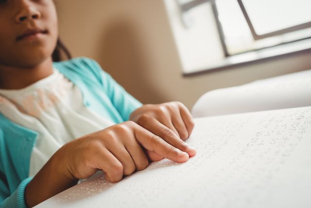 Girl using braille to read - Download Free Stock Photos Pikwizard.com