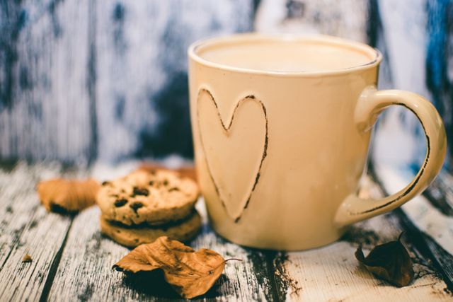 Beige Ceramic Heart Mug With Coffee Beside Cookie Food - Download Free Stock Photos Pikwizard.com