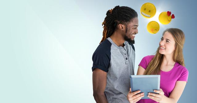 Man and woman with tablet and emojis against blue background - Download Free Stock Photos Pikwizard.com